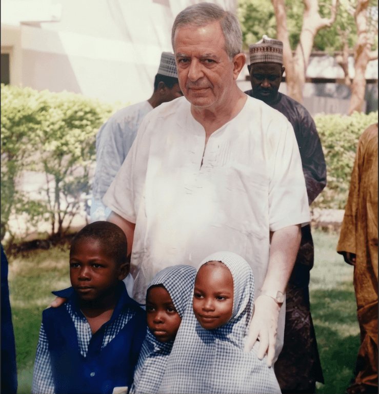 The founder with students