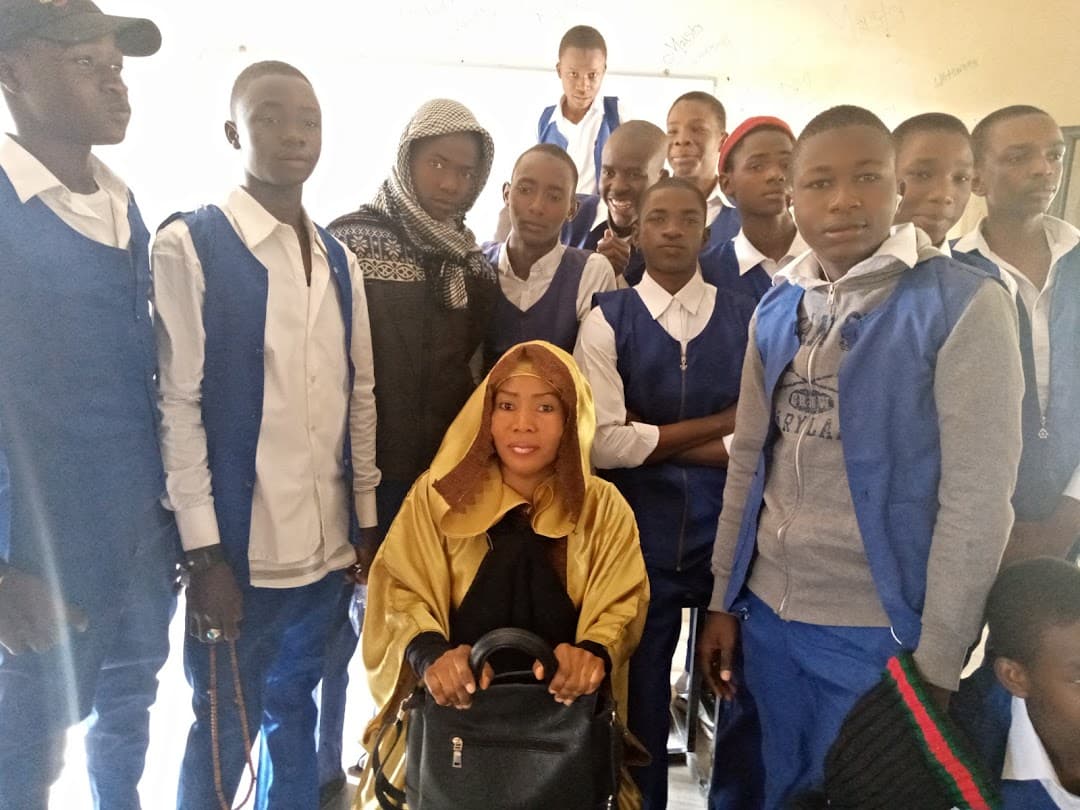 A teacher with students